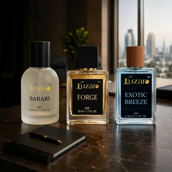 Luzars Barari frosted, Forge golden, and Exotic Breeze blue EDP 50ml perfume bottles on luxury brown marble office table with black notebook and pen, blurred city skyline window background, executive premium fragrance trio with plain black caps, 560x560