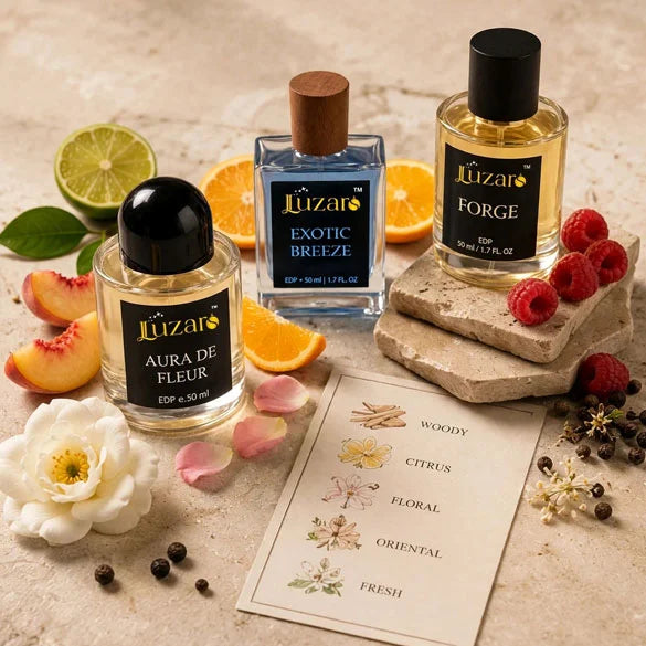 Luzaro Aura De Fleur, Exotic Breeze, and Forge EDP 50ml perfume trio on beige stone surface with woody citrus floral oriental fresh fragrance note card, lime slice, white flower and black peppercorns – luxury perfume flat lay collection