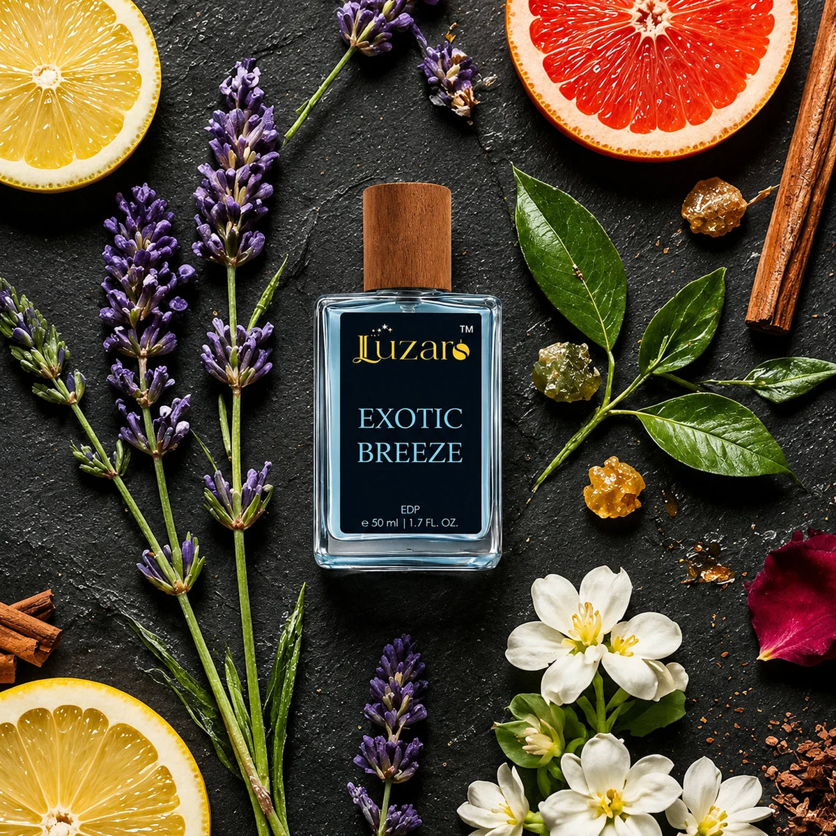 Luzaro Exotic Breeze EDP 50ml blue perfume bottle with wooden cap on dark stone flat lay background surrounded by lavender, lemon slices, grapefruit, cinnamon sticks, white jasmine flowers and green leaves - top view luxury botanical fragrance